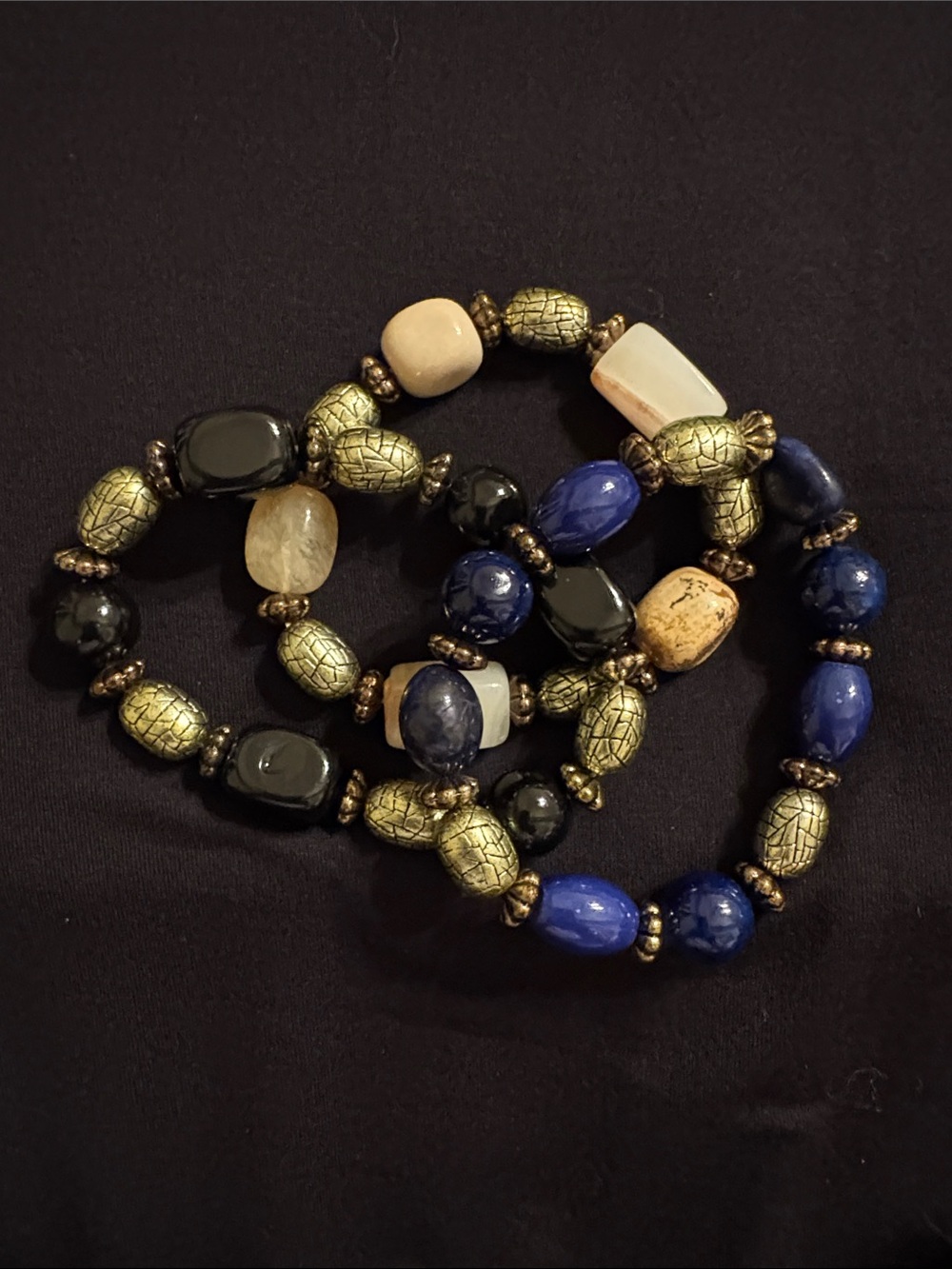 Set Of Multi-Bead Stretch Bracelets in Blue, Black, Cream In Golden Tones